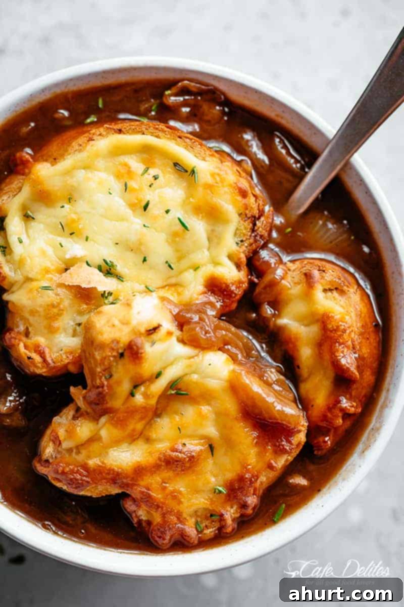 Classic French Onion Soup finished off with garlic bread and two types of melted cheese 