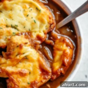 Caramelized Onion Bliss 2 French Onion Soup in a bowl with spoon