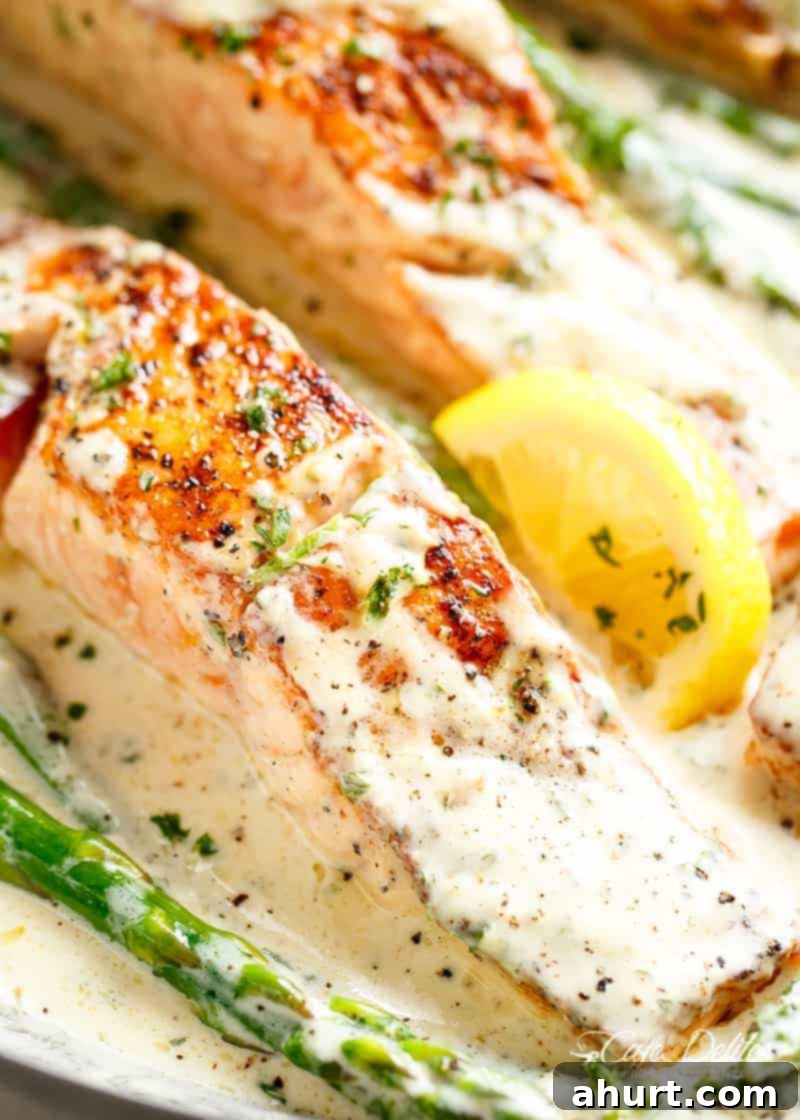 Dijon-Glazed Salmon 3 Salmon with Creamy Dijon Sauce and lemon wedges
