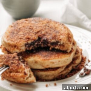 Cinnamon Sugar Doughnut Pancakes with Creamy Nutella Filling 5 Nutella Stuffed Cinnamon Sugar Donut Pancakes stack on each other