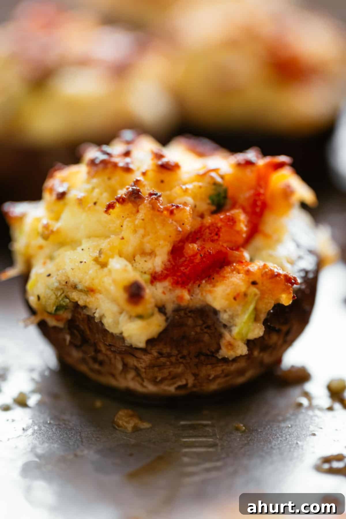Irresistible Crab Dip Stuffed Mushrooms with cream cheese. A vibrant display of crab dip stuffed mushrooms, showcasing the creamy filling and golden topping.