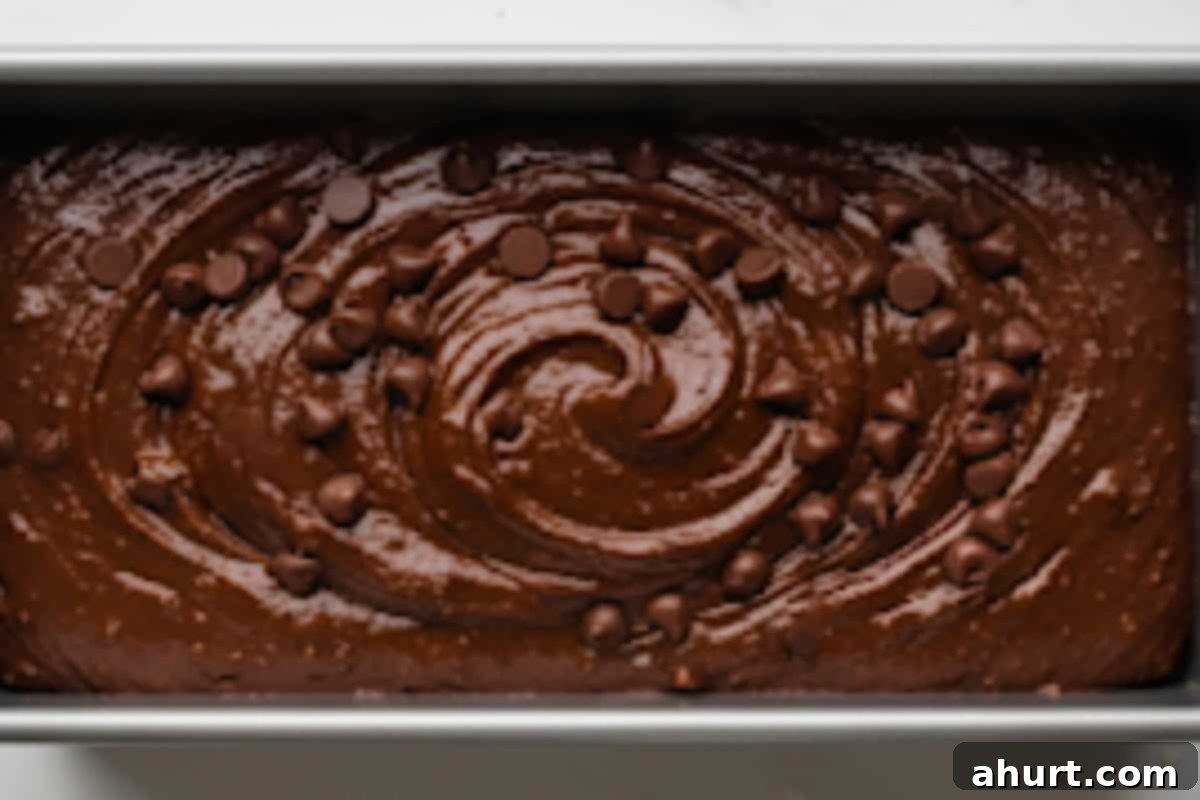 Decadent Double Chocolate Banana Loaf 8 Pour batter into the pan and sprinkle chocolate chips.