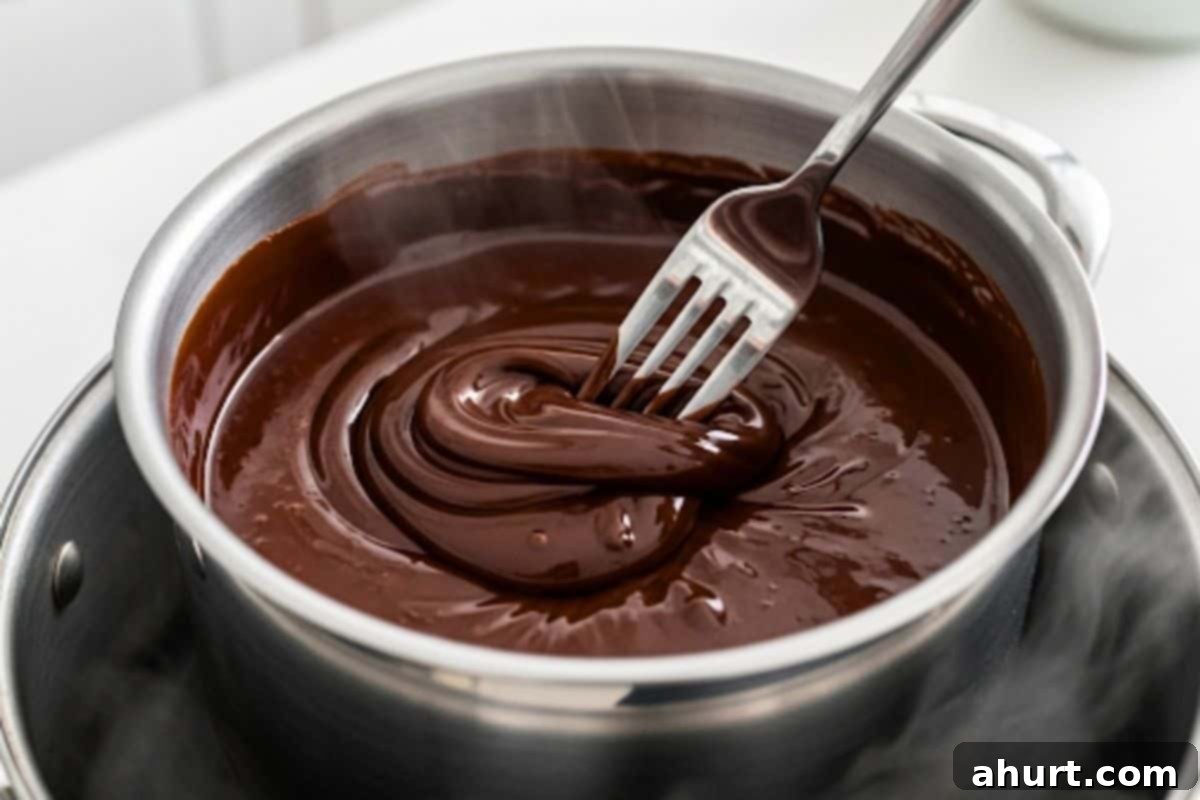 Chocolate-Dipped Banana Heaven 4 Place the chocolate in a heatproof metal bowl over a pan of gently simmering water. Stir with a fork until fully melted