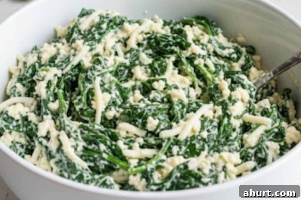 Baked Spinach Manicotti 7 Combining creamy ricotta, spinach, mozzarella, Parmesan, eggs, garlic, seasoning, nutmeg, salt, and pepper in a bowl for the manicotti filling.