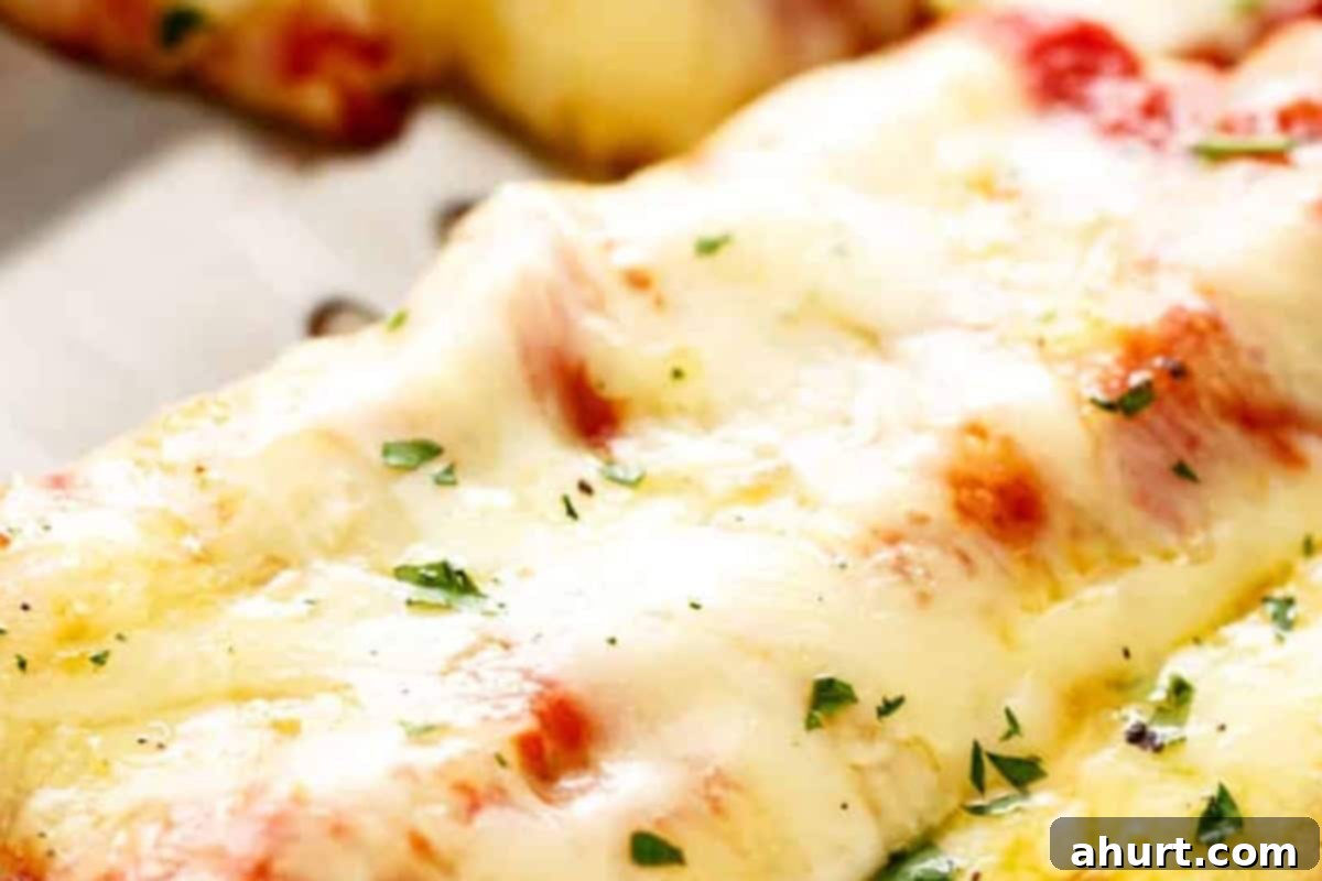 Baked Spinach Manicotti 10 Spoon remaining marinara sauce over filled manicotti shells and top with mozzarella and Parmesan cheese, ready to bake.