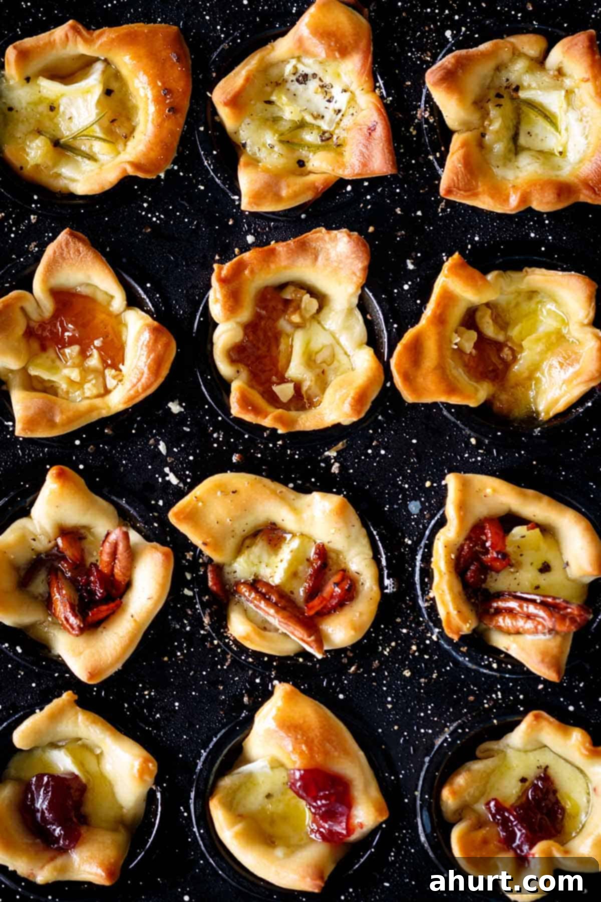 Irresistible Baked Brie Sampler 2 Deliciously looking Baked Brie Bites in a mini muffin tin.