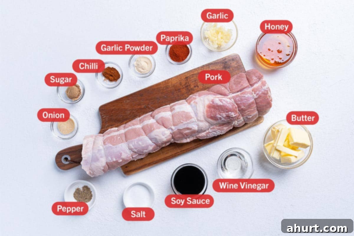 Tender & Juicy Oven-Roasted Pork Loin 2 Image of the ingredients needed for the preparation of the Roast Pork Loin, specifically: onion, sugar, chili, garlic powder, paprika, garlic, honey, butter, wine vinegar, soy sauce, salt, pepper, and pork
