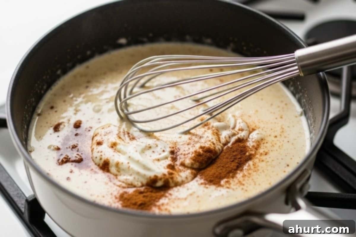 Best Creamy Eggnog Recipe 3 in a sauce pan, combine milk, cream, vanilla and nutmeg