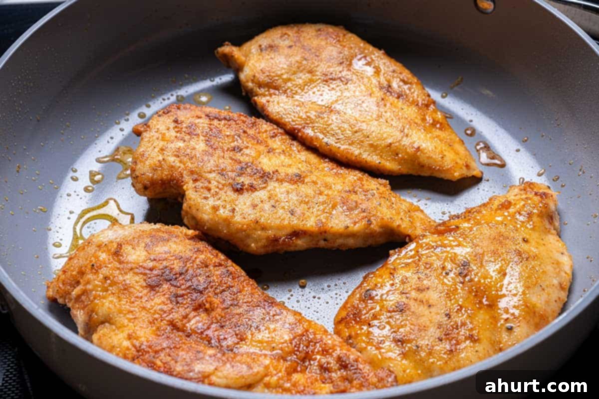 Chicken Stroganoff 4 seasoned chicken seared in a pan