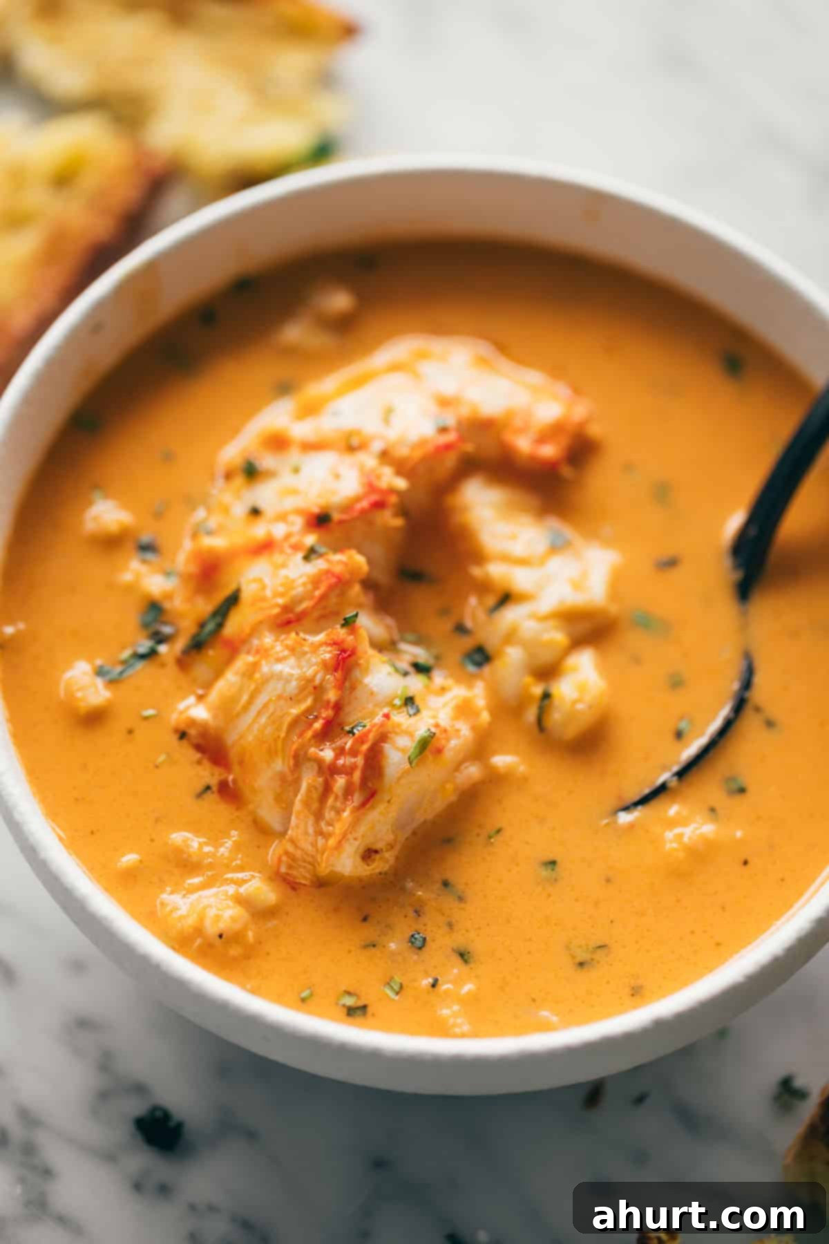 Lobster bisque #lobstertails #lobsterbisque Scrumptious lobster bisque topped with generous chunks of tender lobster tail and freshly cut thyme and tarragon, beautifully presented with a side of toasted artisan bread