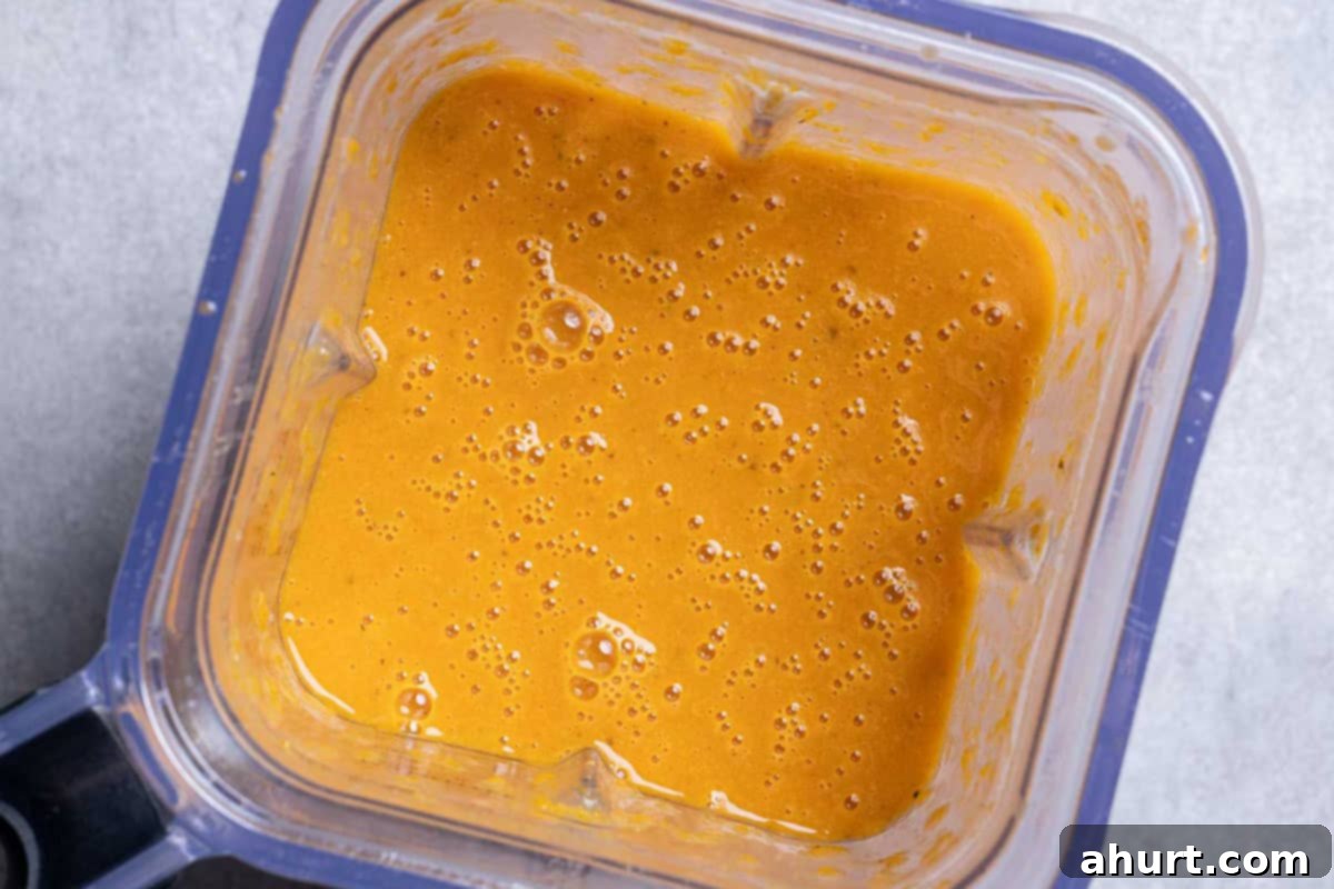 Luxurious Lobster Bisque 11 The rich, aromatic bisque base being blended until perfectly smooth in a high-powered blender, prior to the addition of cream.