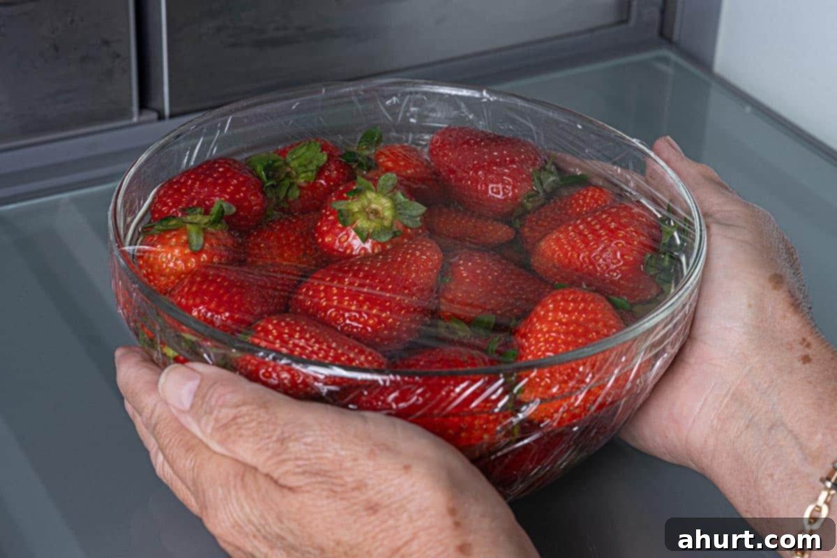 Decadent Champagne Strawberries Infused With Your Favorite Spirit 4 Strawberries covered and placed in the refrigerator, allowing them to absorb the champagne flavor for optimal infusion.