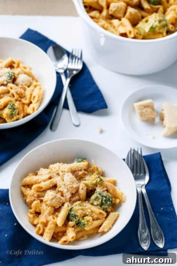 Velvety Pumpkin Chicken Alfredo with Broccoli 8 2 bowls containing Creamy Pumpkin Chicken and Broccoli Alfredo, ready for serving