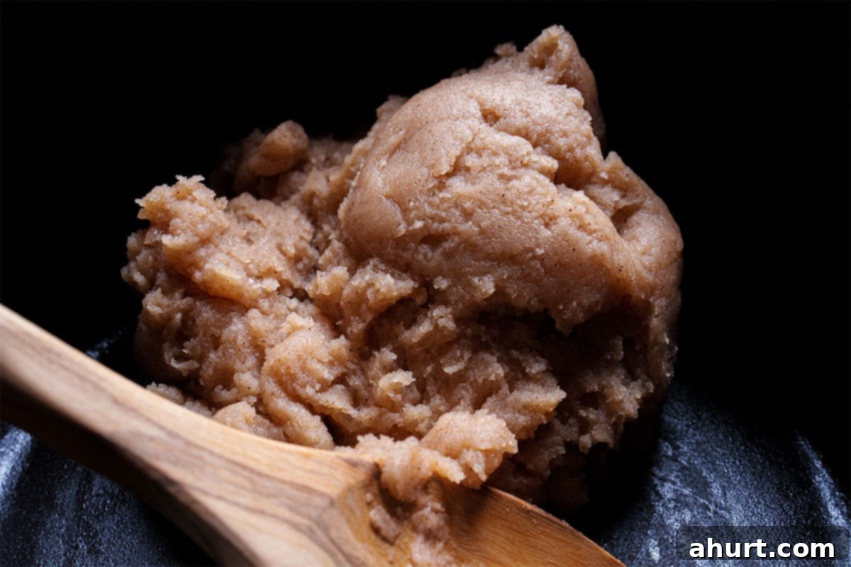 The Ultimate Churros Recipe 4 An image depicting water, sugar, vanilla, cinnamon, and salt being heated with butter in a medium-sized saucepan.