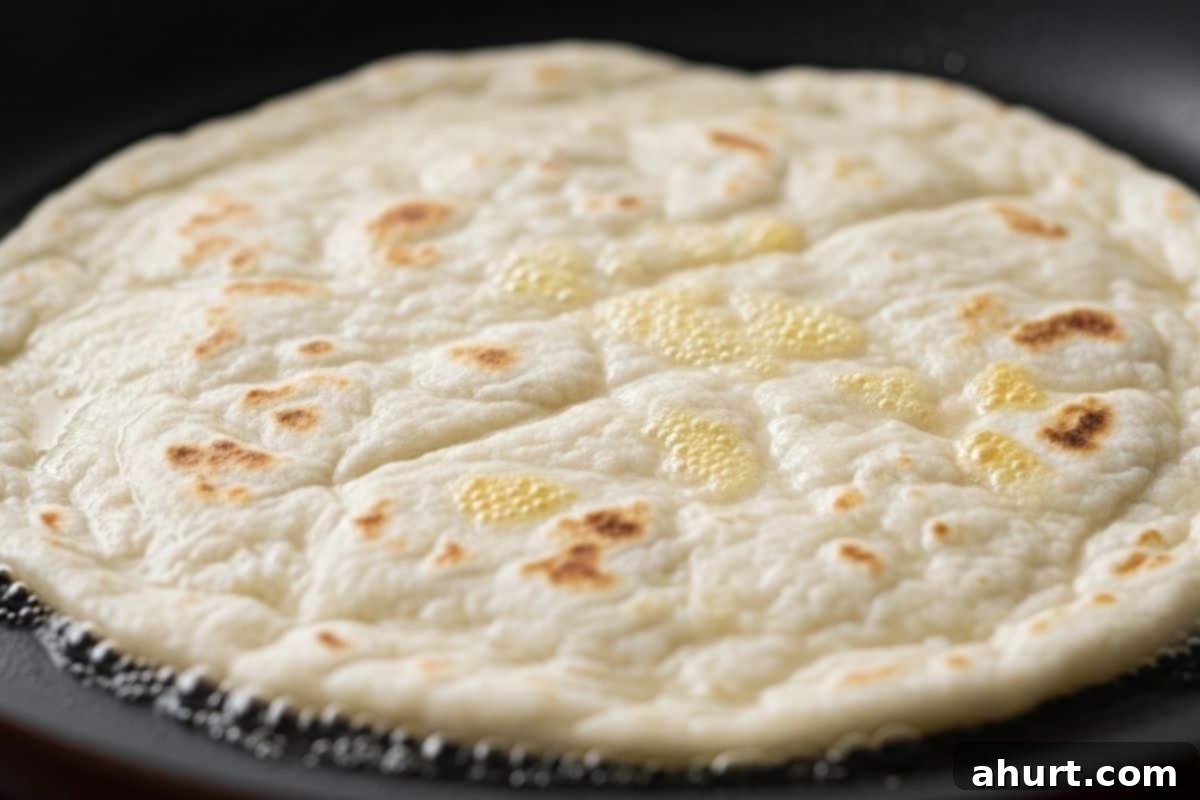 Perfect Homemade Flour Tortillas 8 Place the roll out dough in a hot dry pan and cook until bubbles form and golden spots appears