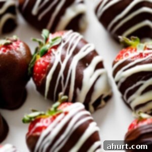 Tipsy Chocolate Strawberries 11 A close up image of a strawberry covered in chocolate.