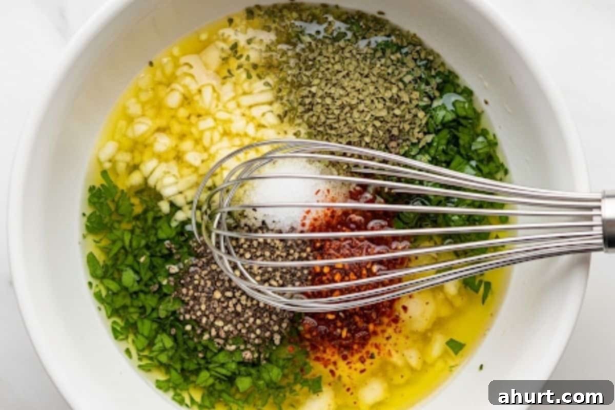 Mediterranean Chickpea Tomato Salad 5 In a small bowl, whisk together olive oil, lemon juice, garlic, oregano, parsley, salt and pepper and a pinch of cayenne pepper.
