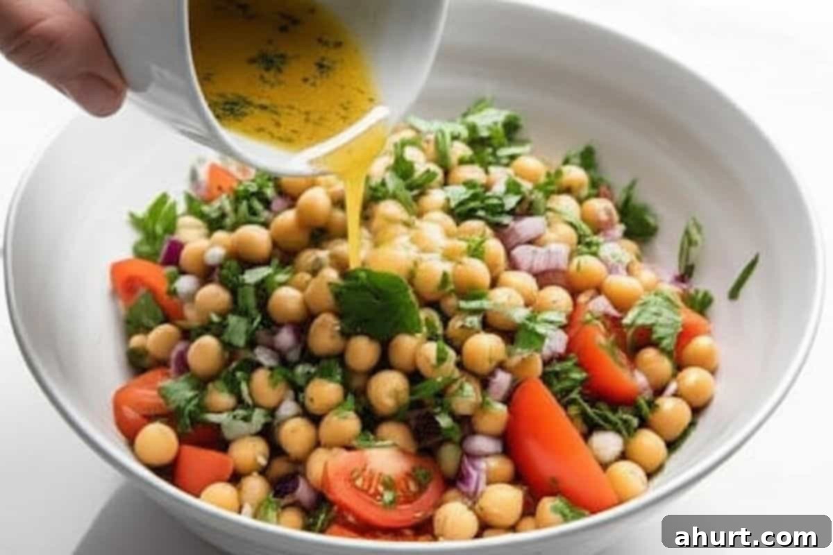 Mediterranean Chickpea Tomato Salad 6 Pour the dressing over the chickpea mixture.