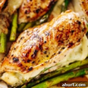 Savory Asparagus Stuffed Chicken Breasts 13 Four asparagus and mozzarella cheese stuffed chicken breasts in a white casserole dish.