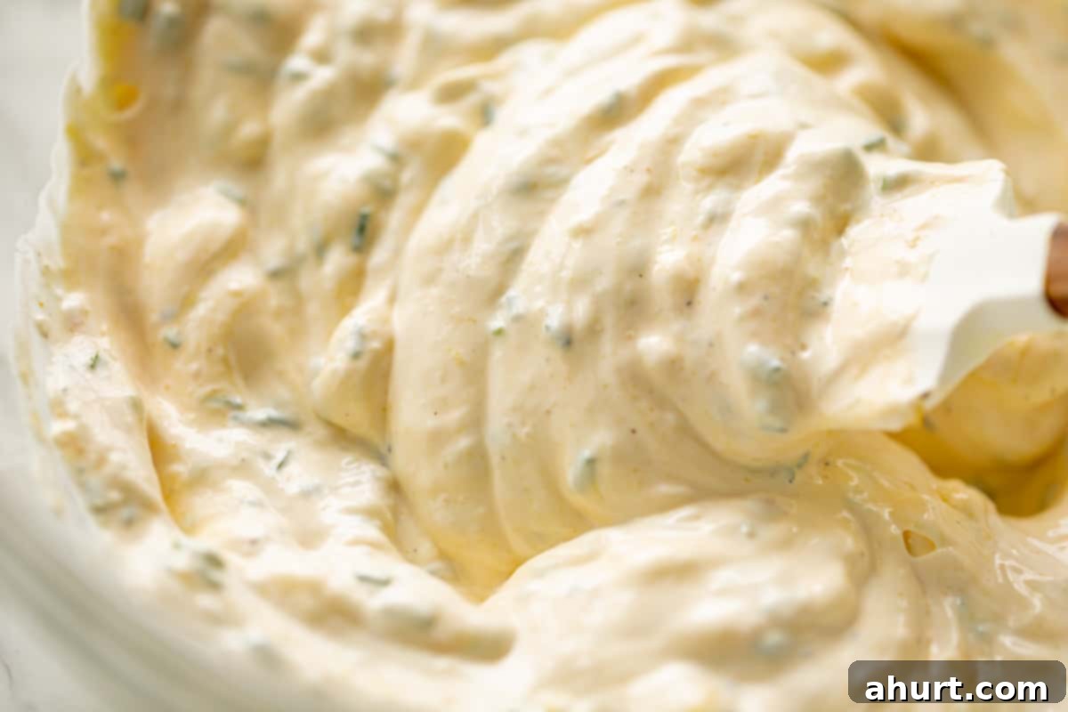 Picnic Perfect Macaroni Salad 4 Zoom in image of Creamy mayonnaise and sour cream dressing for macaroni salad, highlighting its smooth texture.