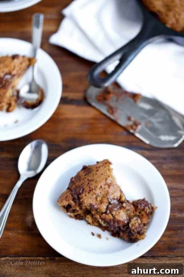 A serving of Peanut Butter Chocolate Chip Deep Dish Skillet Cookie on a plate, before adding ice cream or sauce.