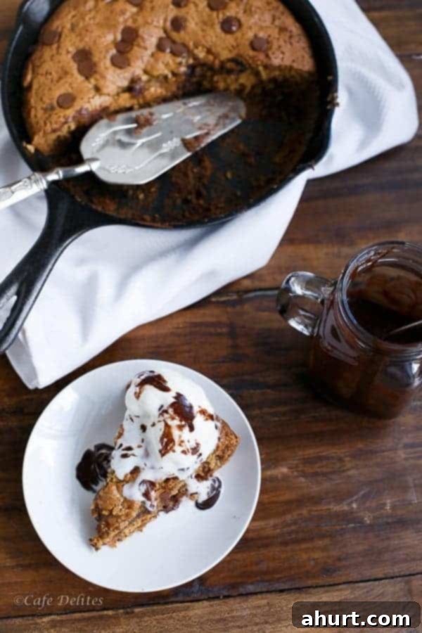 A wide shot of the Peanut Butter Chocolate Chip Deep Dish Skillet Cookie in its baking pan, showing the full, generous size.