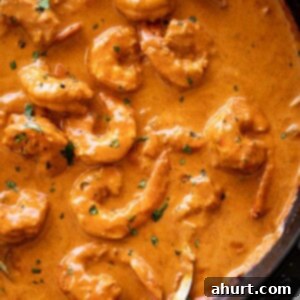 Creamy Coconut Shrimp Curry 5 A flavor-filled shrimp curry with an aromatic coconut curry sauce cooks in no time from scratch! Shrimp curry in a black skillet with a metal serving spoon.