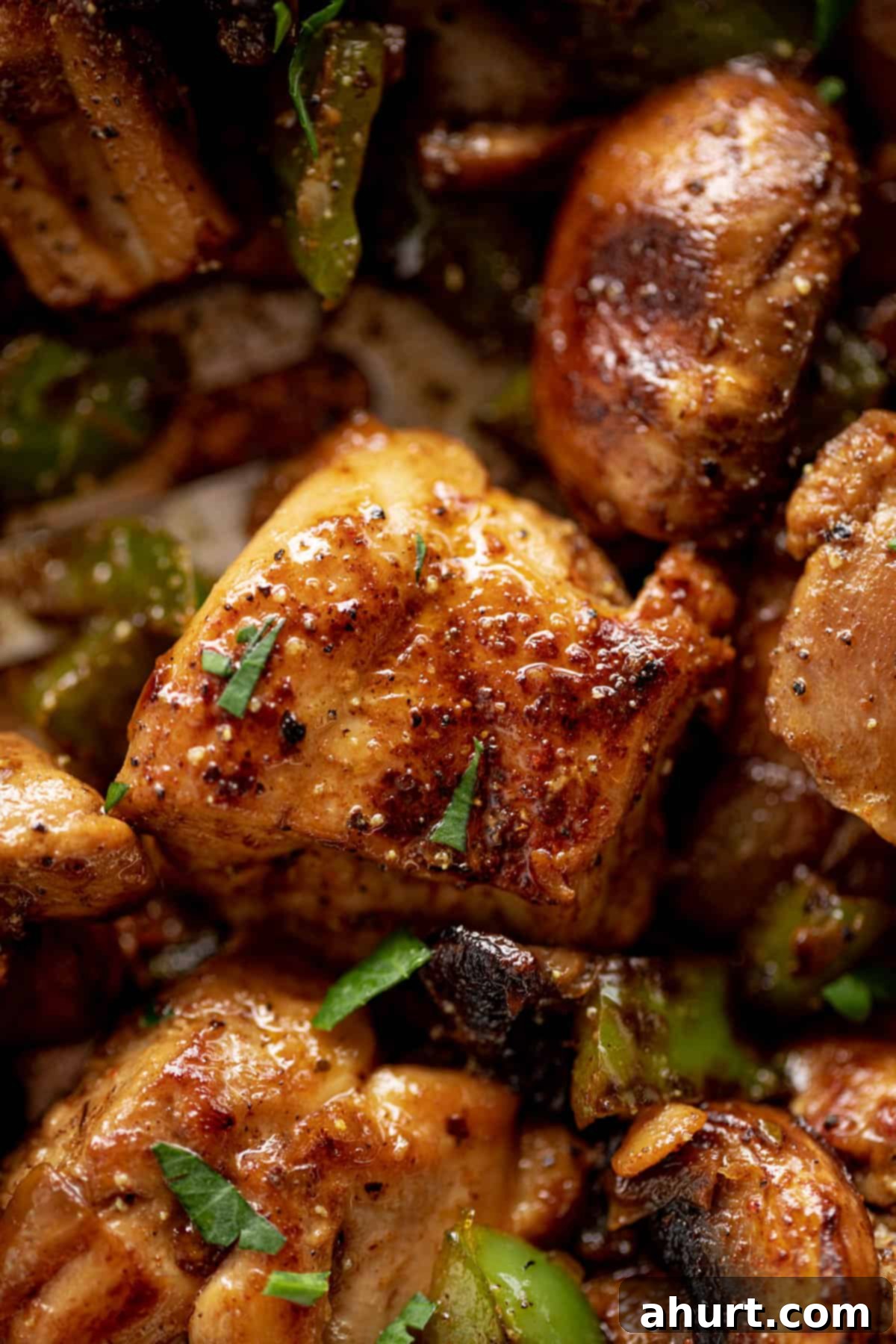 Savory Garlic Mushroom Chicken Poppers 3 Zoom in image of garlic chicken bites covered with parsley.