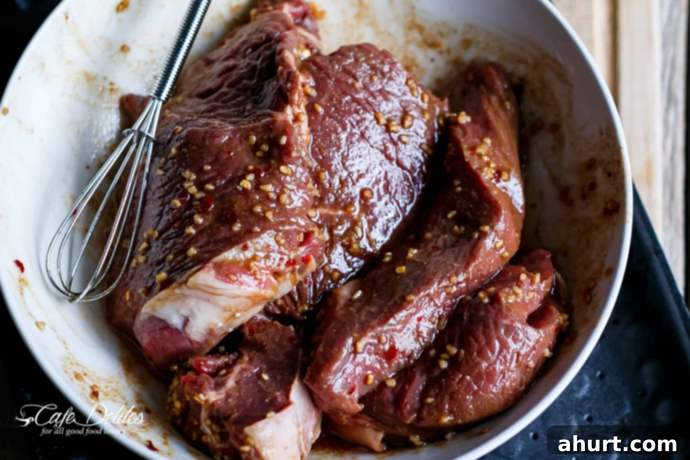 Raw marinated Steak in a bowl