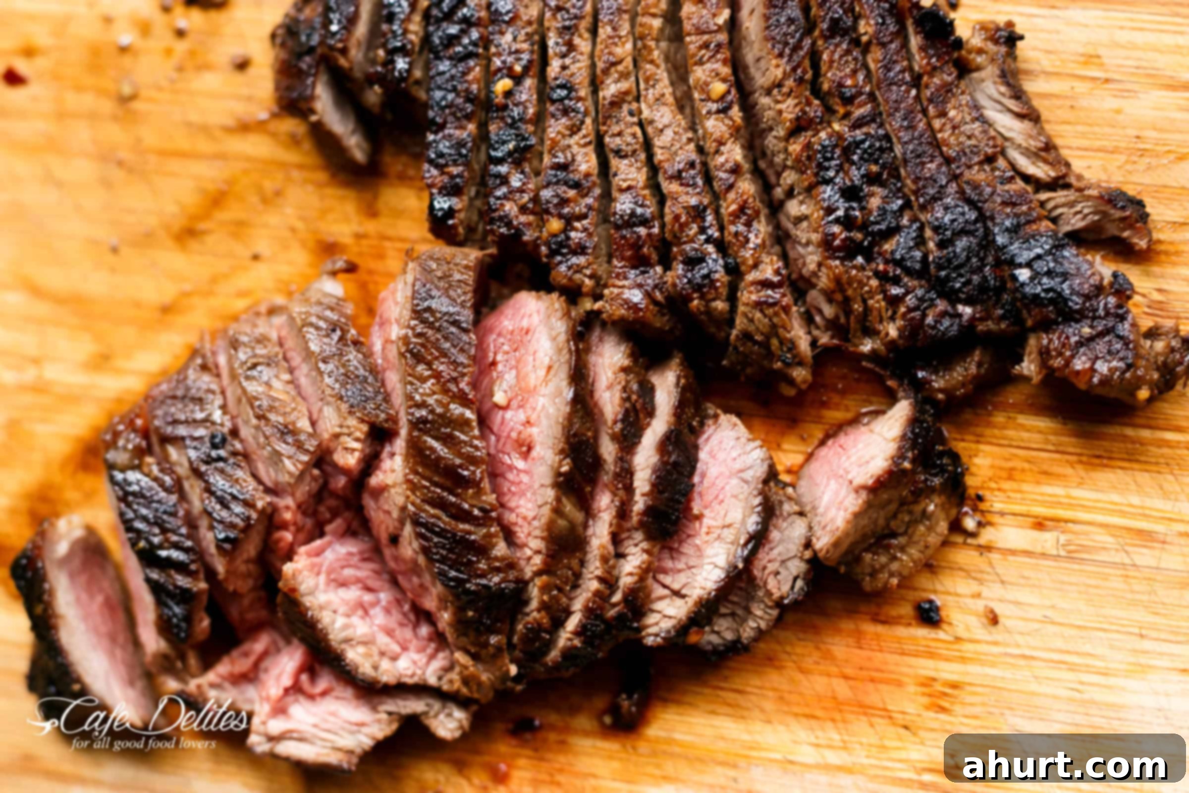 Grilled Steak slices on a wooden plank