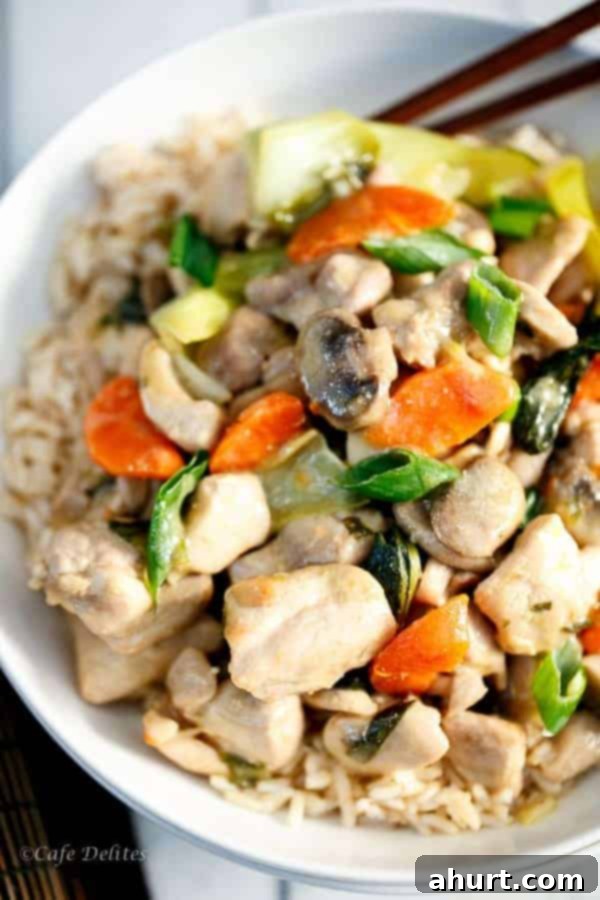 Overhead shot of a wok or large pan filled with vibrant Honey Mustard Chicken Stir Fry, showcasing the colorful ingredients