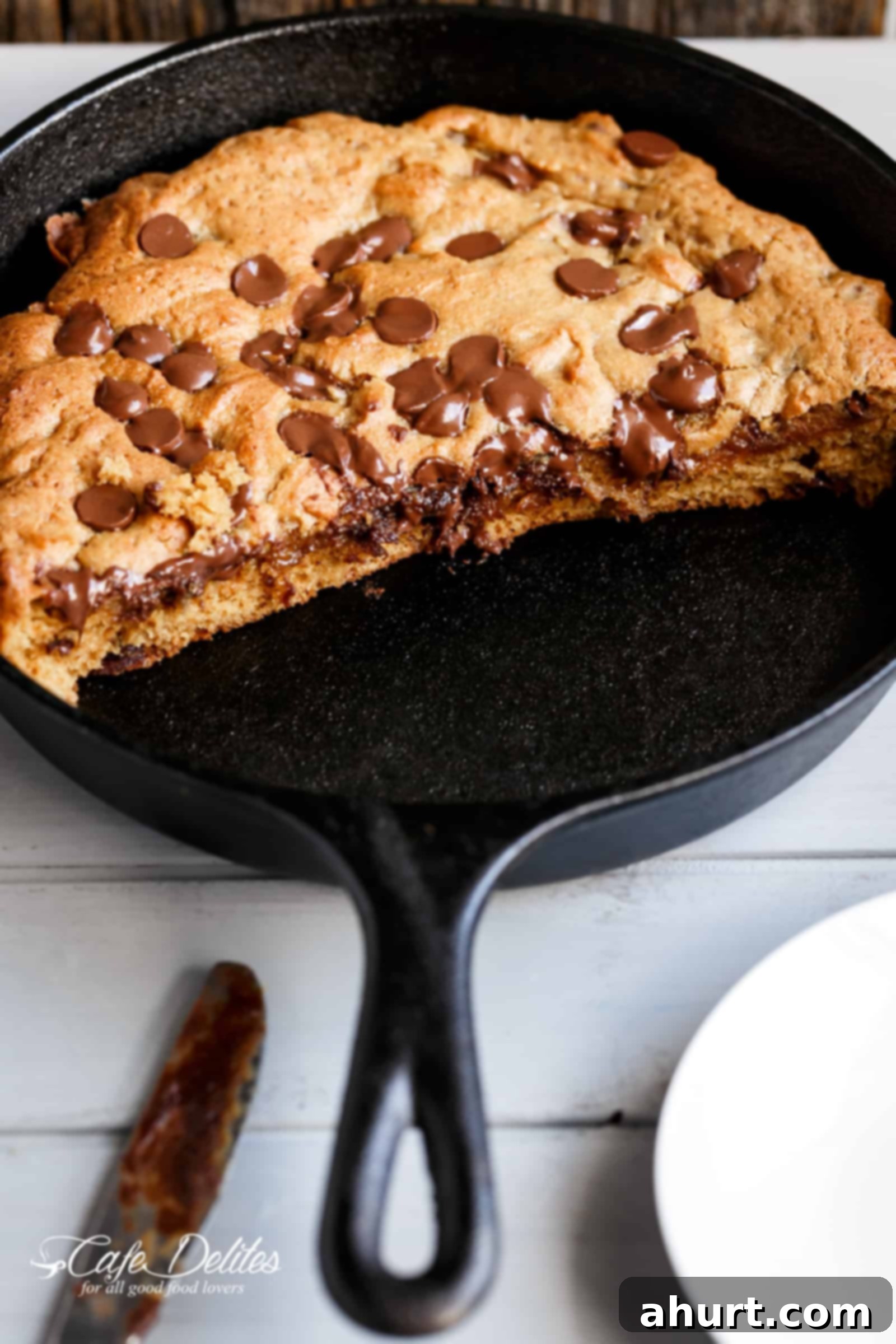 The best Nutella stuffed deep dish chocolate chip skillet cookie | cafedelites.com The best buttery and gooey Nutella stuffed deep dish chocolate chip skillet cookie