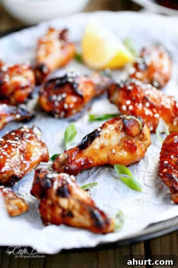 Honey Sesame Glazed Chicken 8 Sticky Honey Sesame Chicken Wings on a butter paper