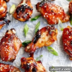 Honey Sesame Glazed Chicken 9 Sticky Honey Sesame Chicken Wings on a baking tray