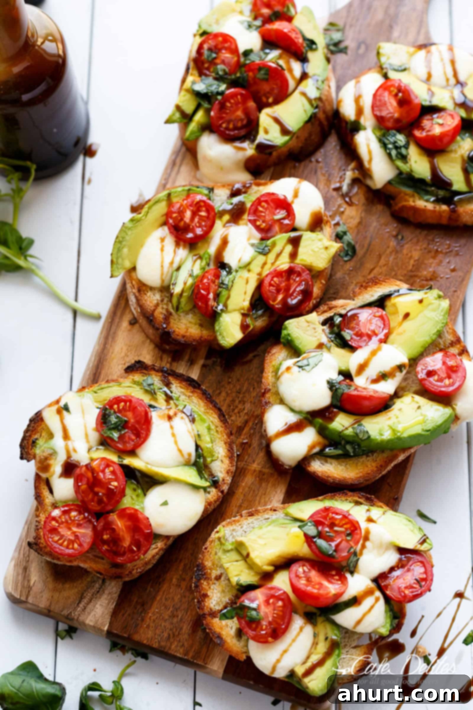Zesty Caprese Crostini with Smoky Grilled Avocado 2 Grilled Avocado Caprese Crostini infused with olive oil and piled high with Caprese flavours!