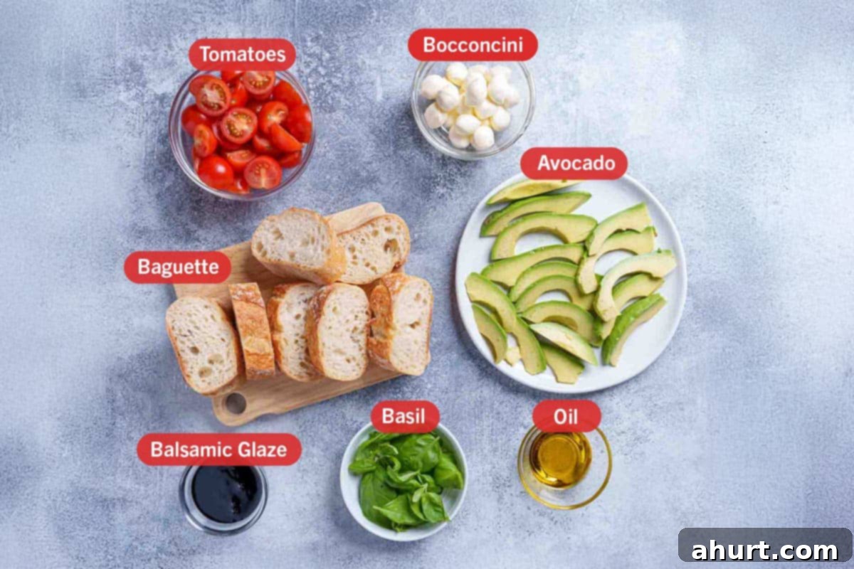 Zesty Caprese Crostini with Smoky Grilled Avocado 3 Image of the ingredients needed for the preparation of this recipe, specifically: tomatoes, bocconcini, baguette, avocado, balsamic glaze, basil, oil.