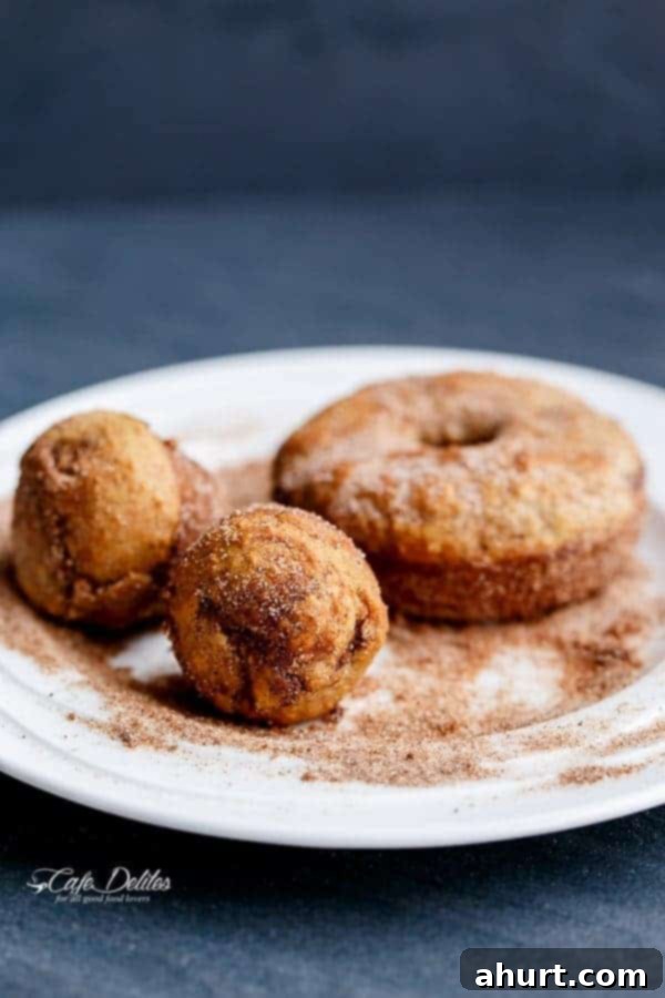 Warm Banana Bread Doughnuts, Bursting with Nutella 8 an alternative to the traditional open hole donuts, this is a ball donut stuffed with nuttela on a plate