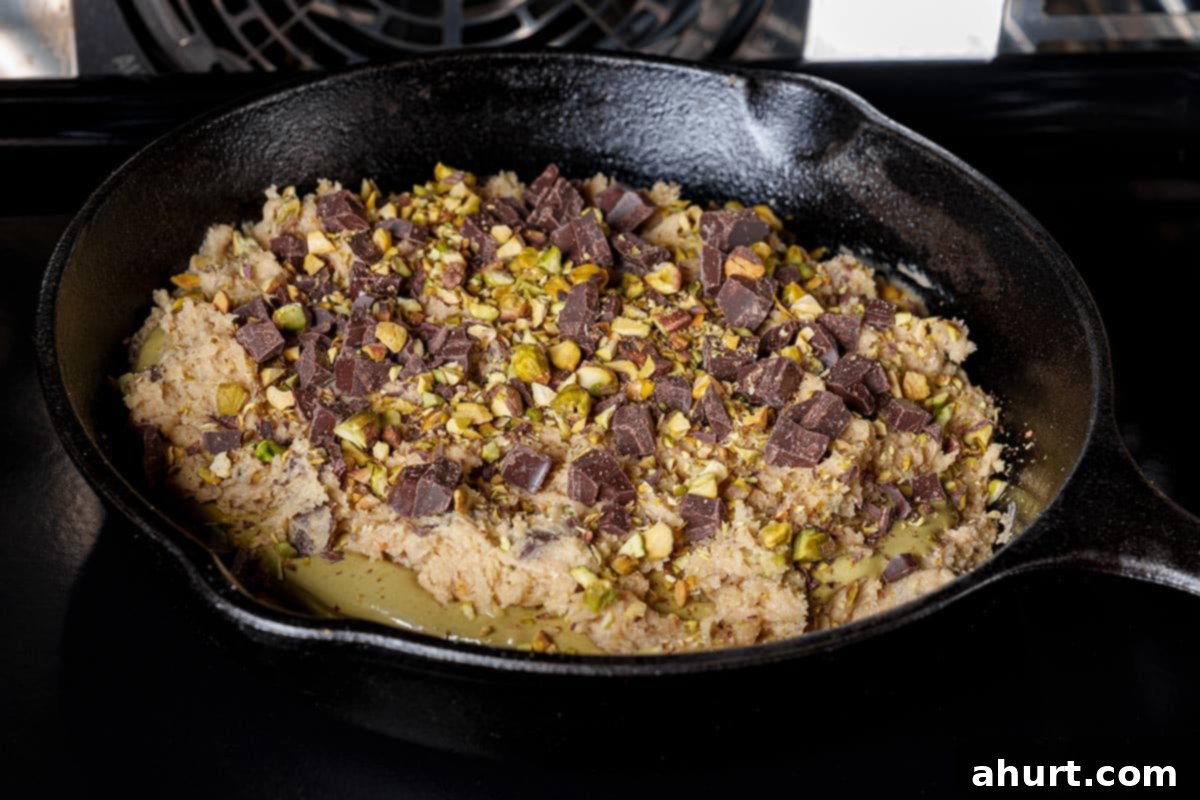 Pistachio Chocolate Chip Skillet Cookie 11 Step 8: Bake the skillet cookie for 20 minutes for gooeyness. For a more set cookie, cover with foil and bake an additional 10 minutes. Cool for 10 minutes before serving.