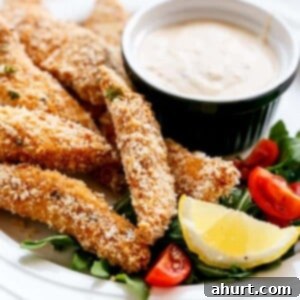 Crunchy Garlic Chicken Strips with a Sweet Chilli Kick 6 Crispy Garlic Chicken Strips with Sweet Chilli Mayo on a plate