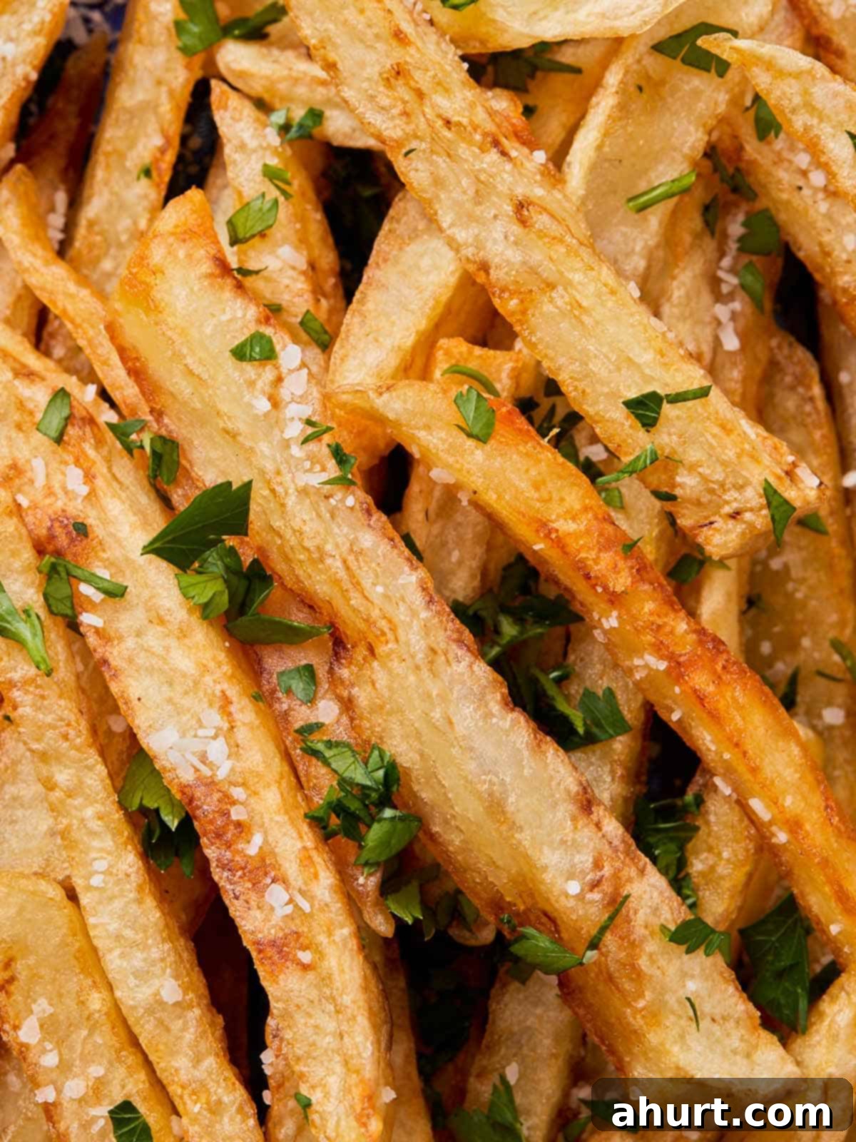 Golden Crispy Fries 8 close up photo of crispy fries with salt and chopped parsley
