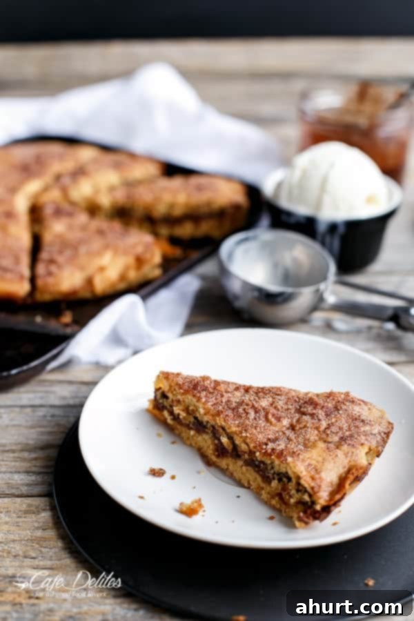 Baked Nutella Stuffed Churro Deep Dish Skillet Cookie slices on a plate