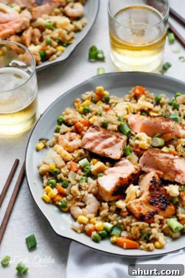 Seared Salmon And Prawn Fried Rice on a plate