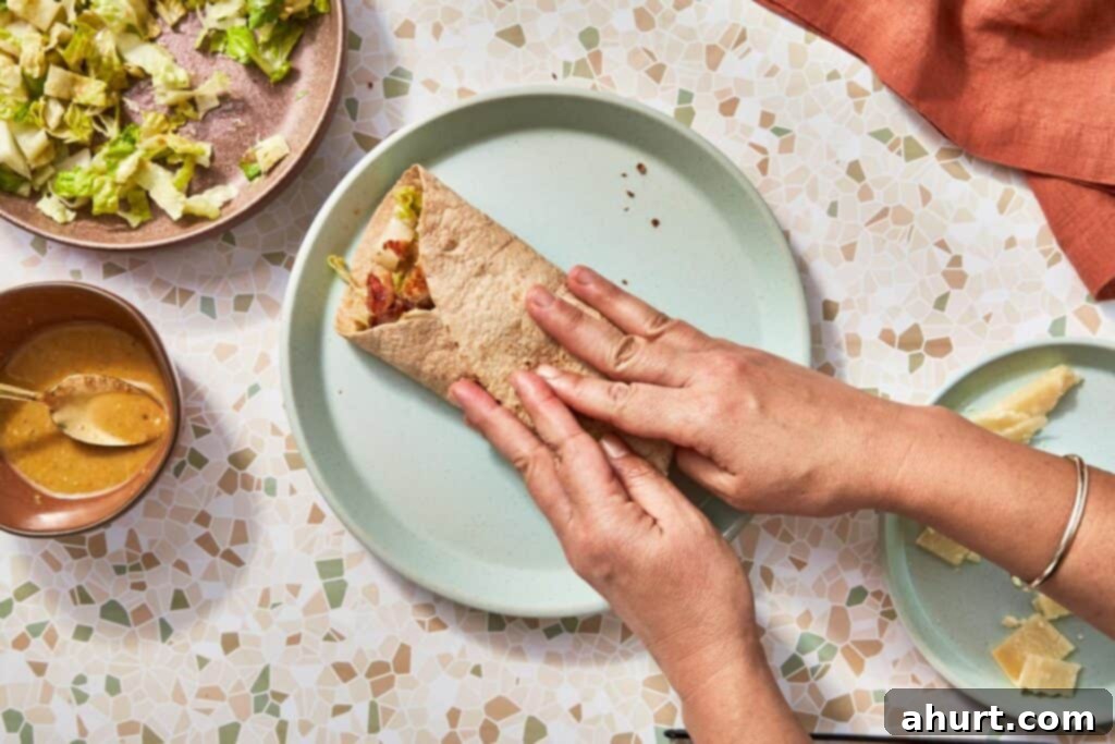 Signature Crispy Caesar Wrap 16 Folding a Caesar wrap.