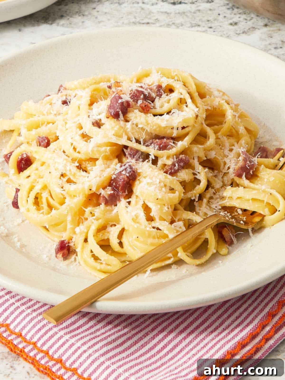 Velvet Carbonara Bliss 2 Creamy carbonara pasta with crispy pancetta and freshly grated Pecorino Romano.
