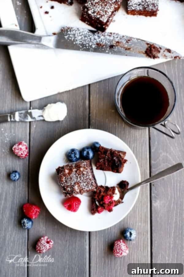Berry Burst Nutella Swirl Brownies 11 Mixed Berry Nutella Brownies pieces on a plate with black coffee