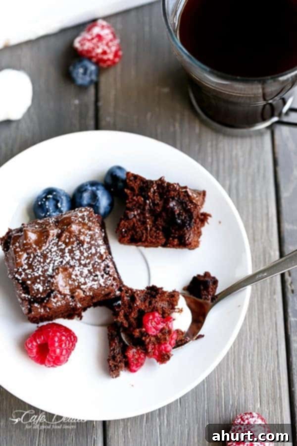 Berry Burst Nutella Swirl Brownies 4 Mixed Berry Nutella Brownies pieces on a plate