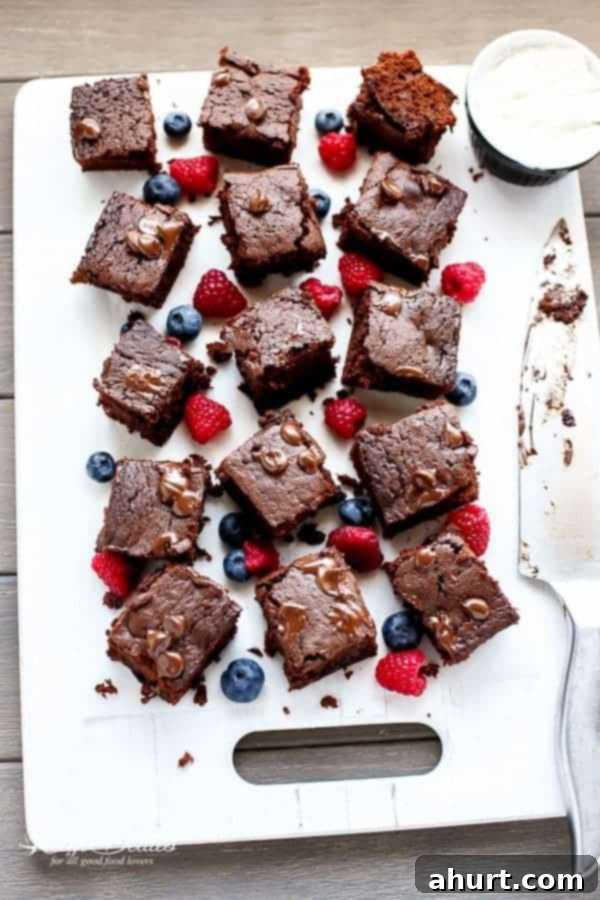 Berry Burst Nutella Swirl Brownies 8 Mixed Berry Nutella Brownies pieces on a baking tray