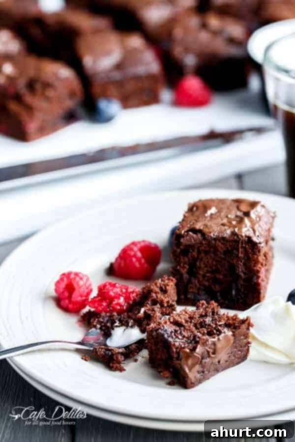 Mixed Berry Nutella Brownies | https://cafedelites.com Mixed Berry Nutella Brownies pieces on a plate