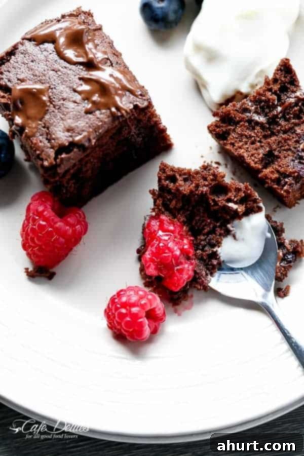Berry Burst Nutella Swirl Brownies 9 A bite of Mixed Berry Nutella Brownies with some fresh berries