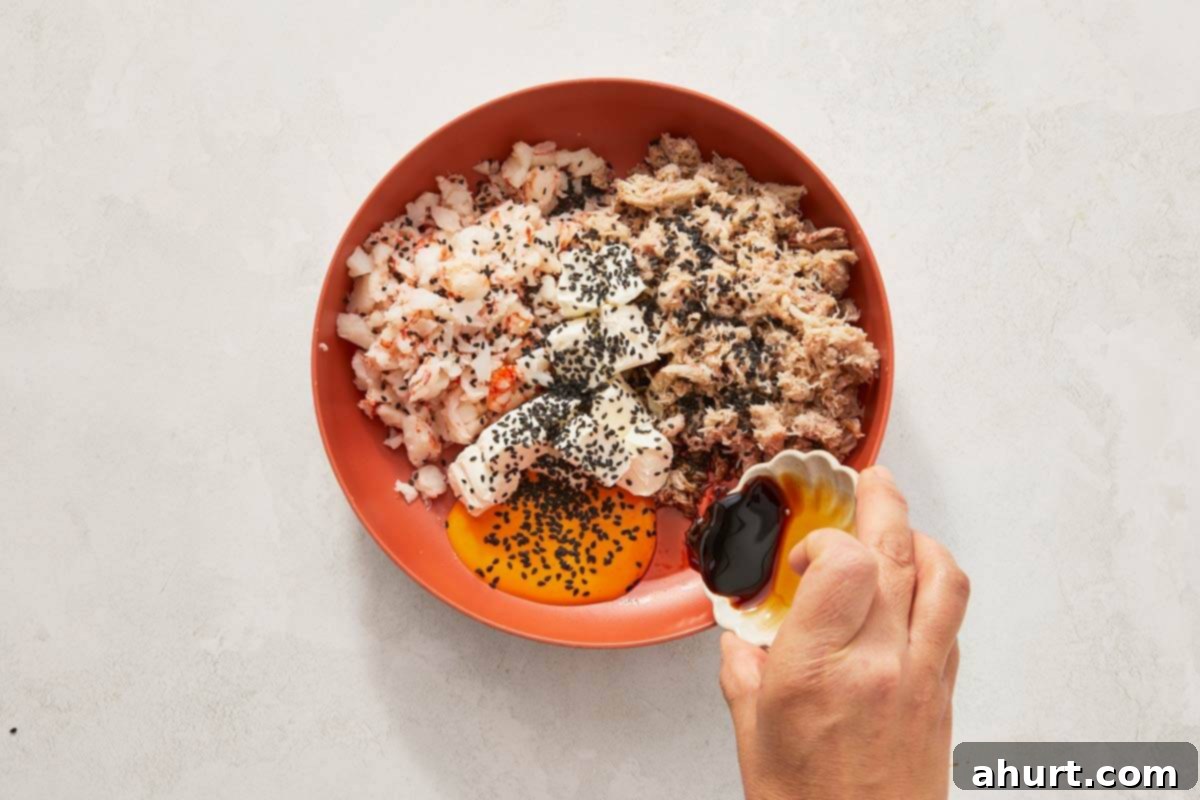Easy At-Home Sushi Bake 6 Spoon poised over a bowl of food.